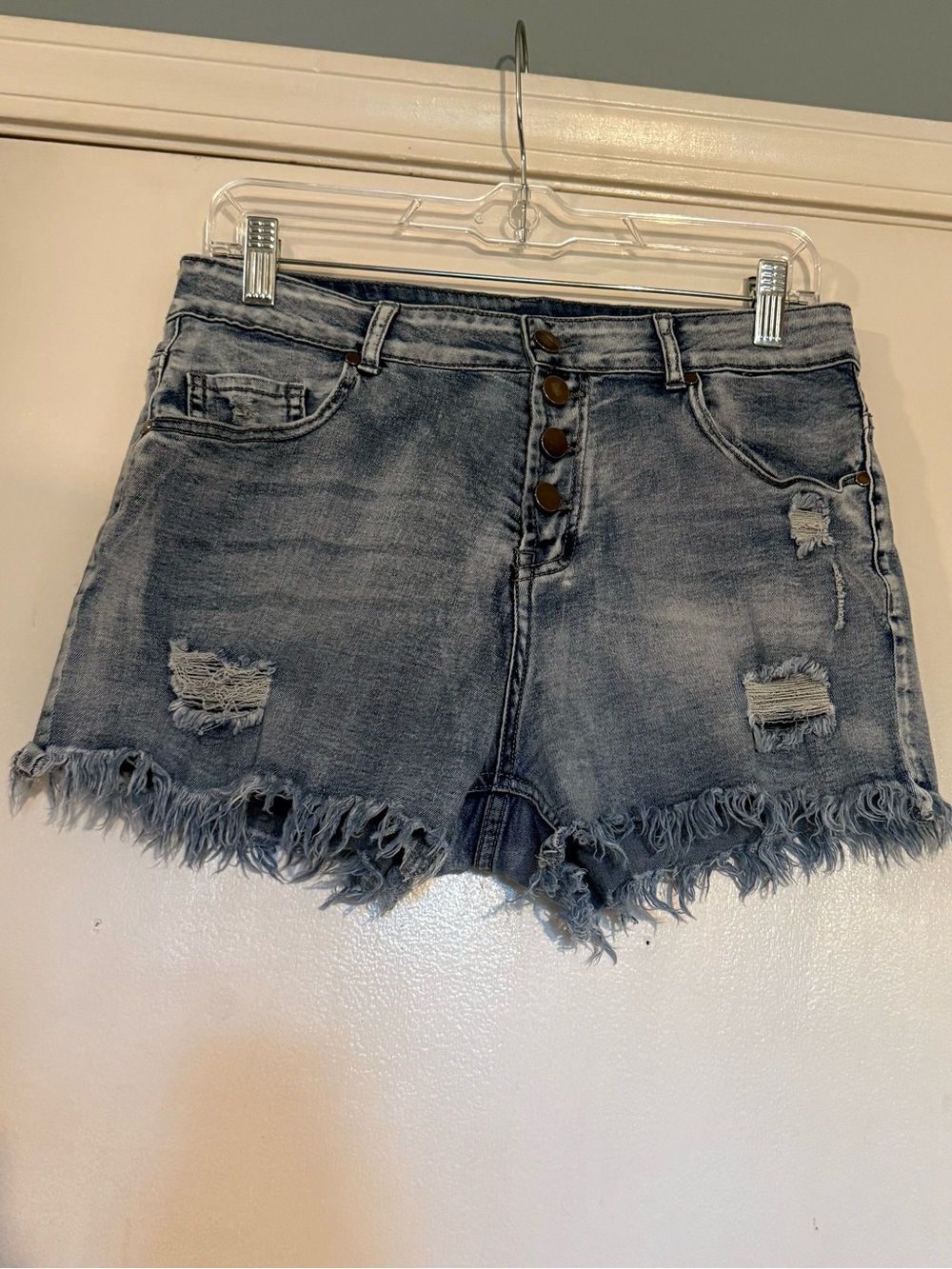 Button fly raw hem blue denim shorts